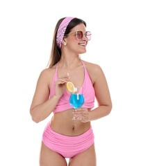 Woman in swimsuit with tropical cocktail on white background