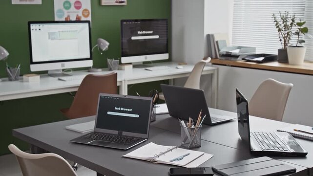 Background shot of modern computer class interior with tech and laptops on table in classroom, no people, copy space