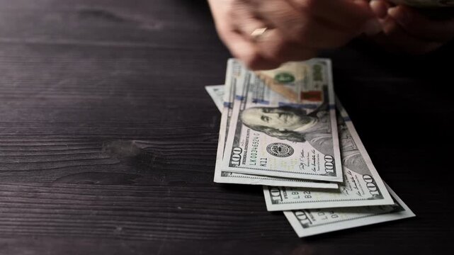 Close Up Of A Woman Counting American Dollar Bills