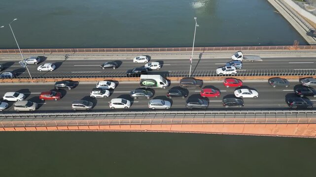 High angle drone shot of heavy traffic jam on motorway bridge in Belgrade, Serbia.