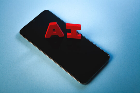 the word of the smartphone on a wooden cubes with a black background