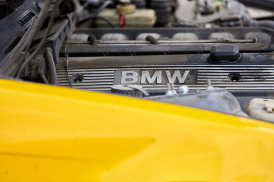 Close-up of yellow bmw car hood and engine detailing. April 17, 2026, Chisinau, Moldova