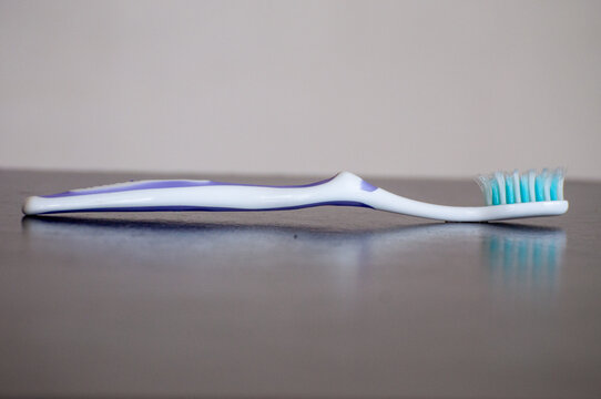 A toothbrush on a table.