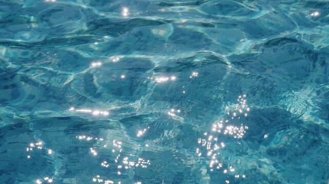 The glare of the sun on the swimming pool water surface, slow motion