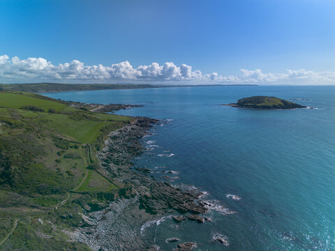 Aerial coastal landscape with Looe Island and the coastal path in Cornwall