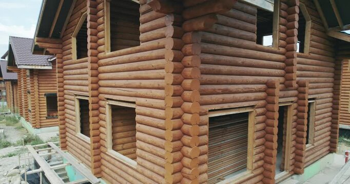 Timber frame house construction building a charming and rustic home with natural wood materials, aerial view