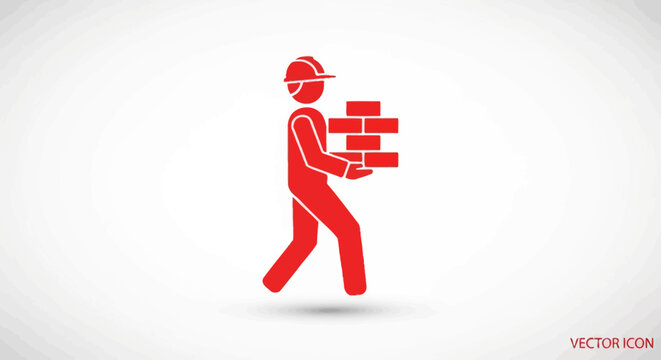 Man carrying bricks for construction work.