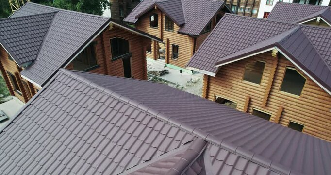 Drying and assembly of wooden log house at a construction base, industrial backgorund, aerial view