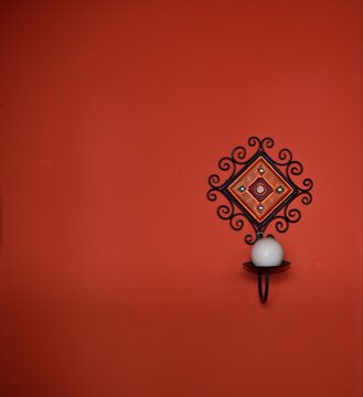 Candle Holder on an Orange Wall