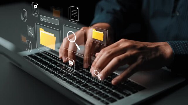 Hands Typing on Laptop with Floating Digital Icons Representing File Folders and Search Functionality in a Modern Work Environment Gluon.
