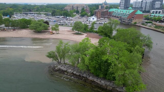 Aerial view of Bronte Beach shoreline and marina district in Oakville.mp4