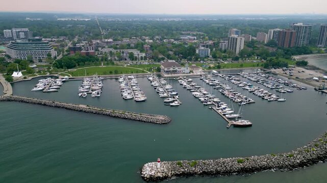 Wide aerial view of Bronte Harbour marina and waterfront park in Oakville.mp4