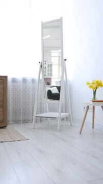 Stylish full length mirror indoors. Interior design