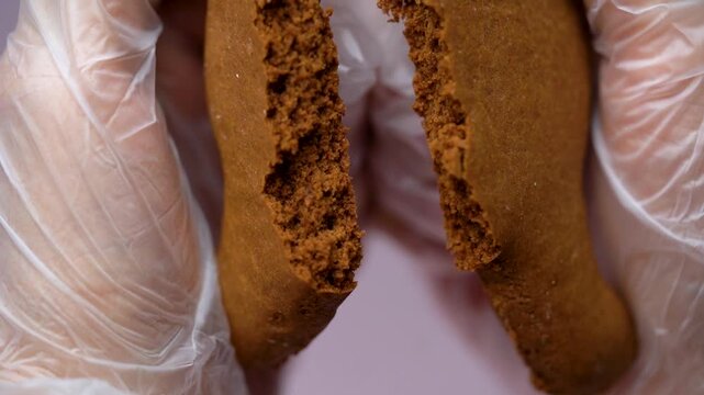 Close Up of Broken Christmas Cookie Showing Texture. Macro close-up video of a Christmas cookie broken in half.