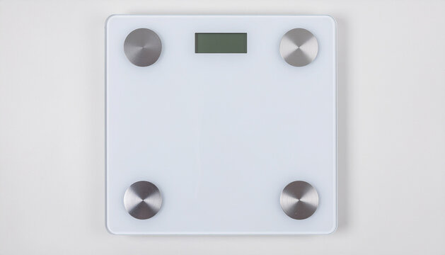 White digital bathroom scale on a white background, top down view