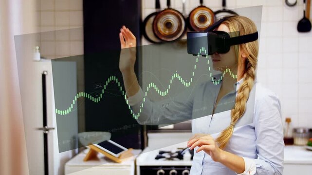 Woman in kitchen wearing MR headset holding hands forward animating green waveform panels for tech