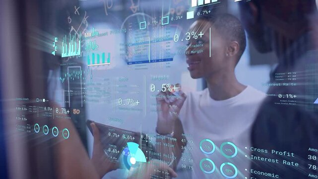 Lead woman writing on glass while tablet tapping animating HUD charts, reaching business consensus