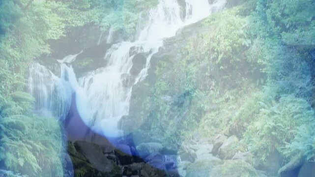 Camera panning down unveiling waterfall tiers while blue overlay drifting across frame