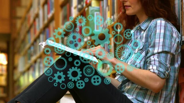 Female reader sitting library aisle turning pages for study, causing turquoise gear overlay pulsing