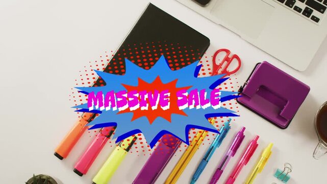 Comic burst appearing, brightening and expanding over flat-lay stationery, promoting MASSIVE SALE