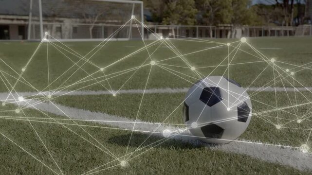 Soccer ball rotating on painted line as camera pulling back, network sweeping to show tactical data