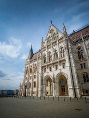Naklejka premium Close-up facade of Hungarian Parliament Building, detailed Gothic Revival architecture, iconic landmark and historic European building in Budapest