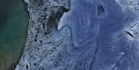Islas Malvinas (Falkland Islands) — Frozen Coastal Margin Satellite View Snow Peat Contrast and Teal Ocean © Aerial View
