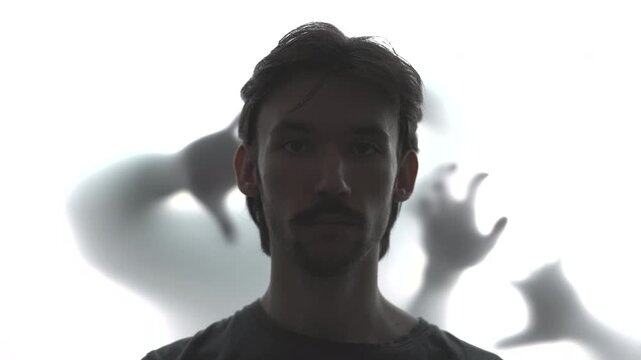 Frosted Glass Menace. Haunting Cinematic Portrayal Of Man In Distress Behind Frosted Glass Shadows . Media