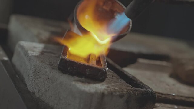 Extreme Close-up of Pouring Molten Liquid Silver into a Metal Mold