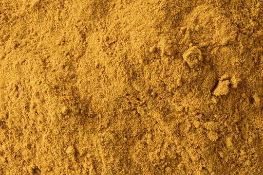 fine ground spice powder in full frame texture, aromatic seasoning curry powder top view, kitchen background concept