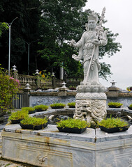 Obraz premium White marble multi-armed Bodhisattva statue lion pedestal Marble Mountains, Da Nang, Vietnam