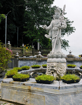 White marble multi-armed Bodhisattva statue lion pedestal Marble Mountains, Da Nang, Vietnam