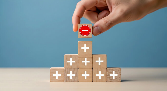 Negative Perspective: A symbolic arrangement of wooden blocks, one marked with a minus sign positioned to alter the positivity of the pyramid structure.