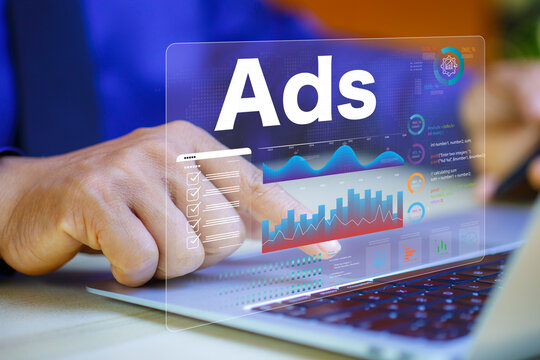 Ads show on laptop display screen from advertisers on Websites with inbound ads to optimize click through rates. Digital marketing and online advertising to targeted customers.