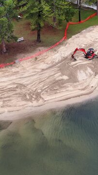 Excavator Renews Sandy Beach Canal in Gold Coast Australia