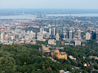 Obraz premium Montreal downtown skyline from Mount Royal with park, lake and greenery in summer, Quebec, Canada. g.