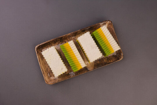 Talam labu is a traditional Southeast Asian layered dessert made from pumpkin, coconut milk, and rice flour, known for its soft and silky texture. 