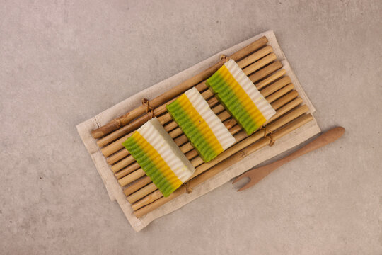 Talam labu is a traditional Southeast Asian layered dessert made from pumpkin, coconut milk, and rice flour, known for its soft and silky texture. 