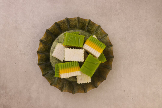 Talam labu is a traditional Southeast Asian layered dessert made from pumpkin, coconut milk, and rice flour, known for its soft and silky texture. 