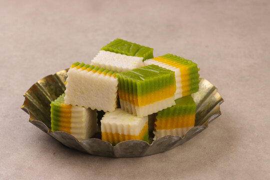Talam labu is a traditional Southeast Asian layered dessert made from pumpkin, coconut milk, and rice flour, known for its soft and silky texture. 