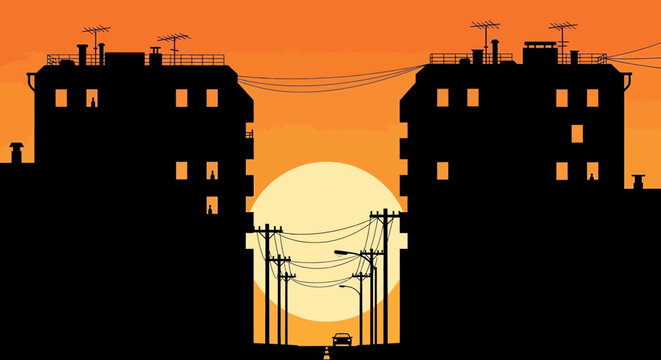 Sunset Silhouette of Urban Buildings Against Dusk Sky.