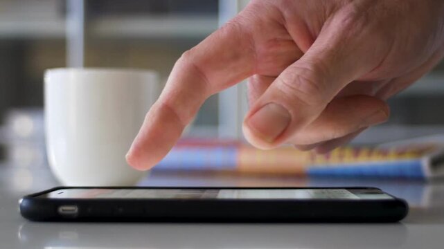 mature older middle aged old adult holding cellphone scrolling and texting message on smartphone digital technology closeup