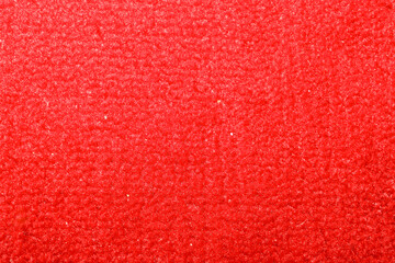 ​A bright red texture of soft pile material creates a rich and uniform background for design solutions. The detailed view of the fibers emphasizes the volume and cozy wooly structure of the fabric, © Олег Струс