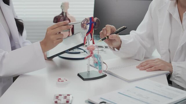 Two Asian female doctors conducted research on enlarged prostate.