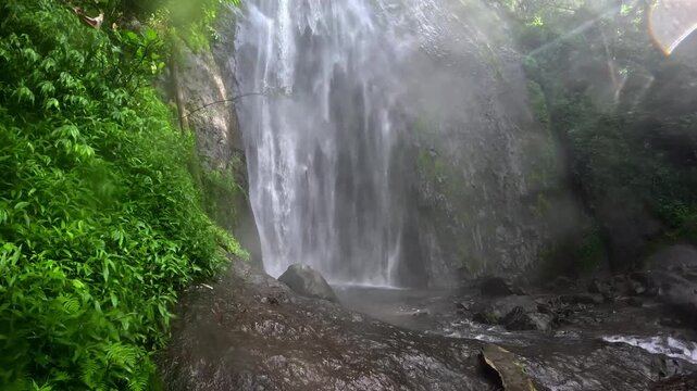 Dolo waterfall, Kediri, East Java, in Indonesia flows rapidly in the morning