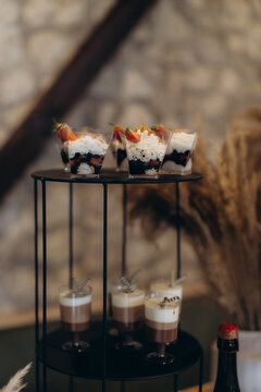 Chocolate and strawberry mini desserts on stand