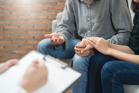 psychologist talking with married couple about depression of husband.