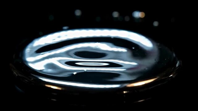 Abstract liquid ripples cymatics ring light reflection dark background 3D render 4K