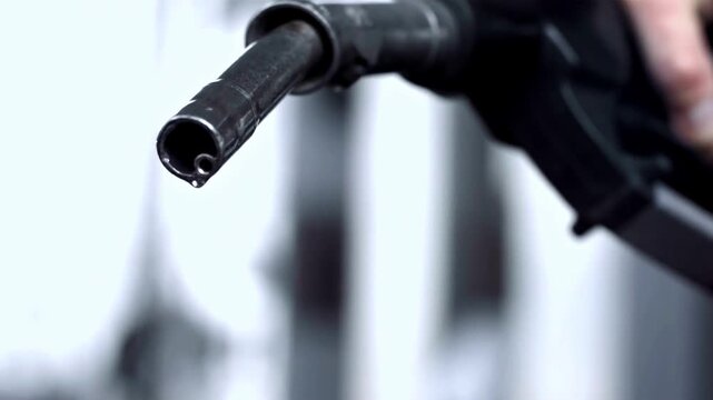 Man filling gasoline fuel in car holding pump. Close up on male hand refuel car relatively high price during war concept benzine transportation