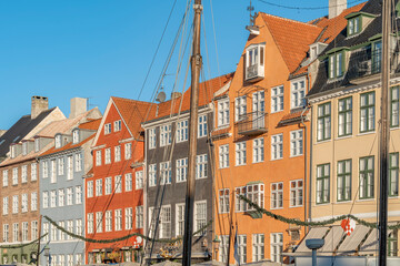 Fototapeta premium Historic Houses in Nyhavn District, Copenhagen, Traditional Danish Architecture, Waterfront Buildings, Canal Side View
